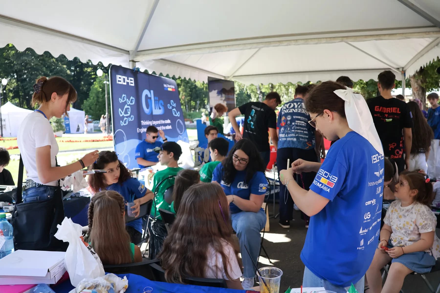 CyLiis students leading hands-on activities for children at CyFest